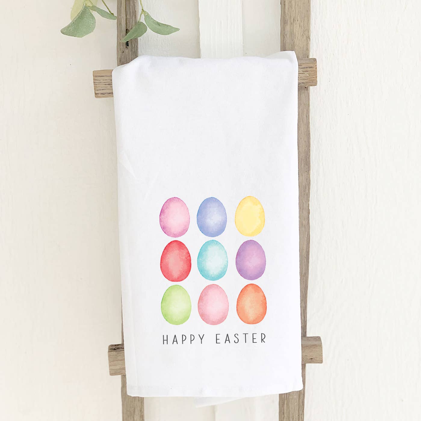 Happy Easter Eggs cotton tea towel featuring vibrant Easter-themed designs, made from 100% absorbent cotton, perfect for kitchen use.