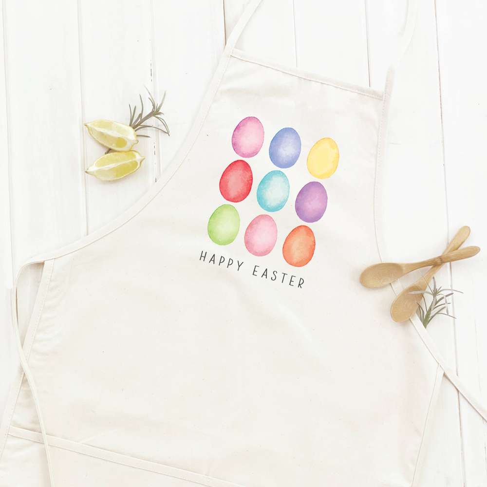 Happy Easter Eggs Women's Apron featuring a colorful egg design, made from durable cotton canvas with adjustable neck and twill ties.