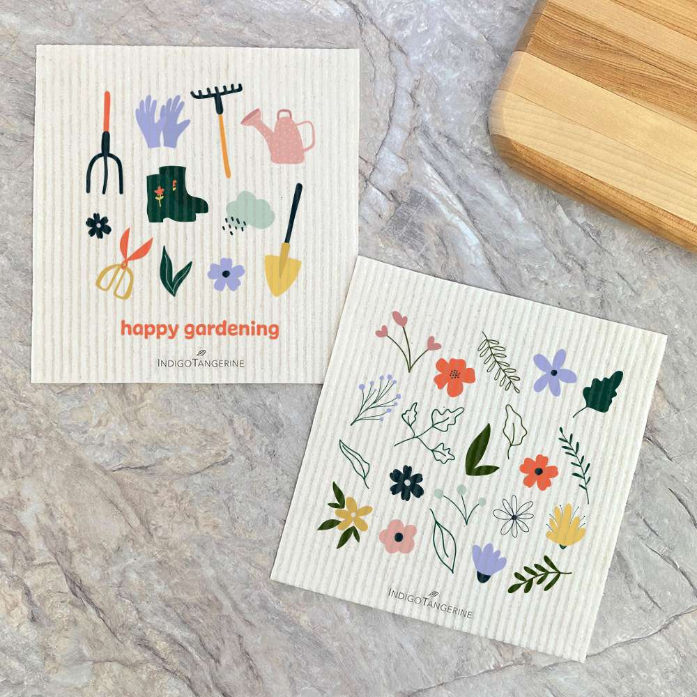 Two eco-friendly Swedish dish cloths with vibrant spring designs, made from plant-based fibers, perfect for sustainable cleaning.