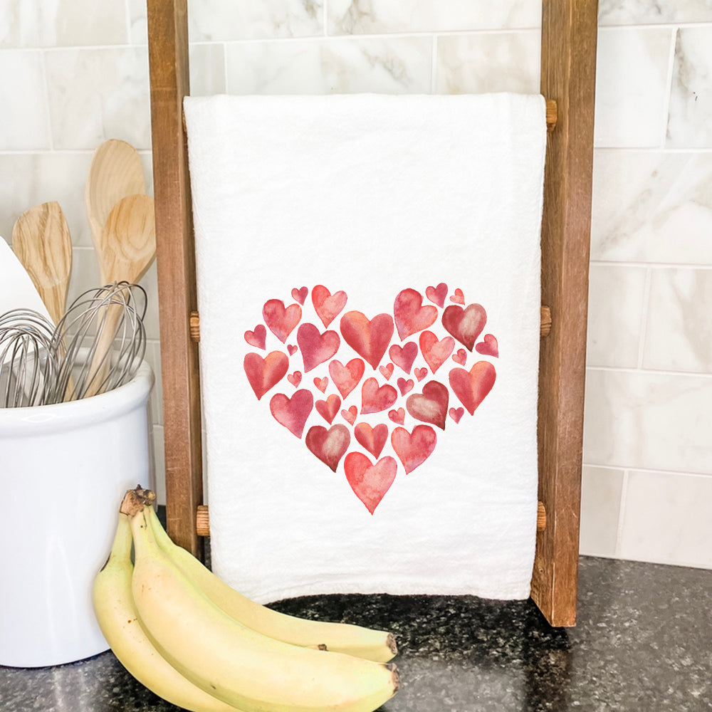 Heart of Hearts Cotton Tea Towel featuring vibrant designs and hemmed edges, perfect for kitchen use.