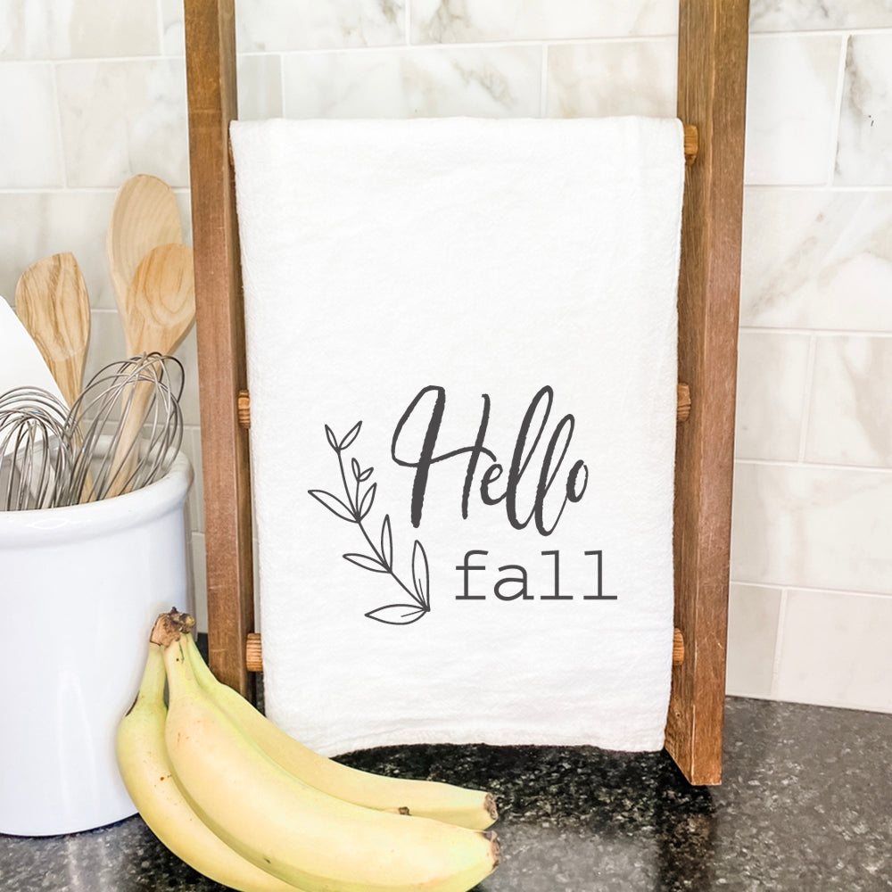 Hello Fall cotton tea towel featuring a vibrant autumn design, made from 100% absorbent cotton with hemmed edges.