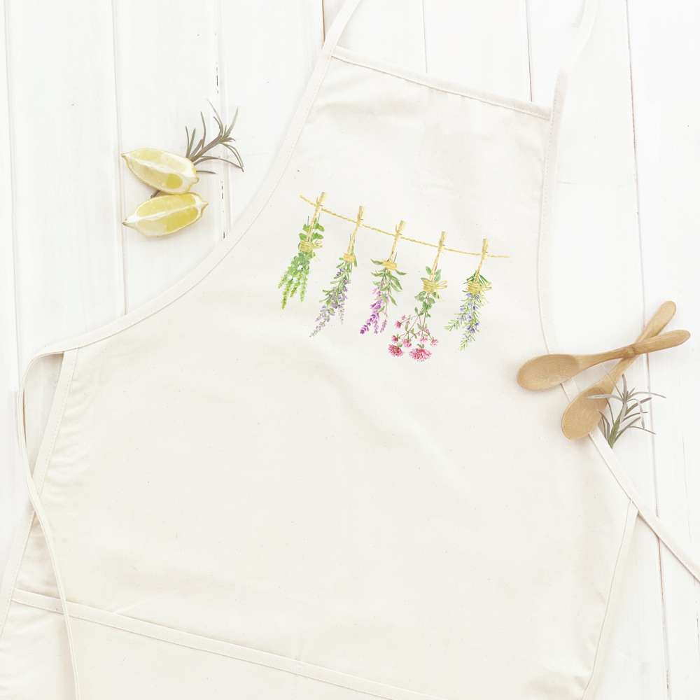 Herbs on a Line Women's Apron featuring elegant design, cotton canvas fabric, and adjustable neck ties.