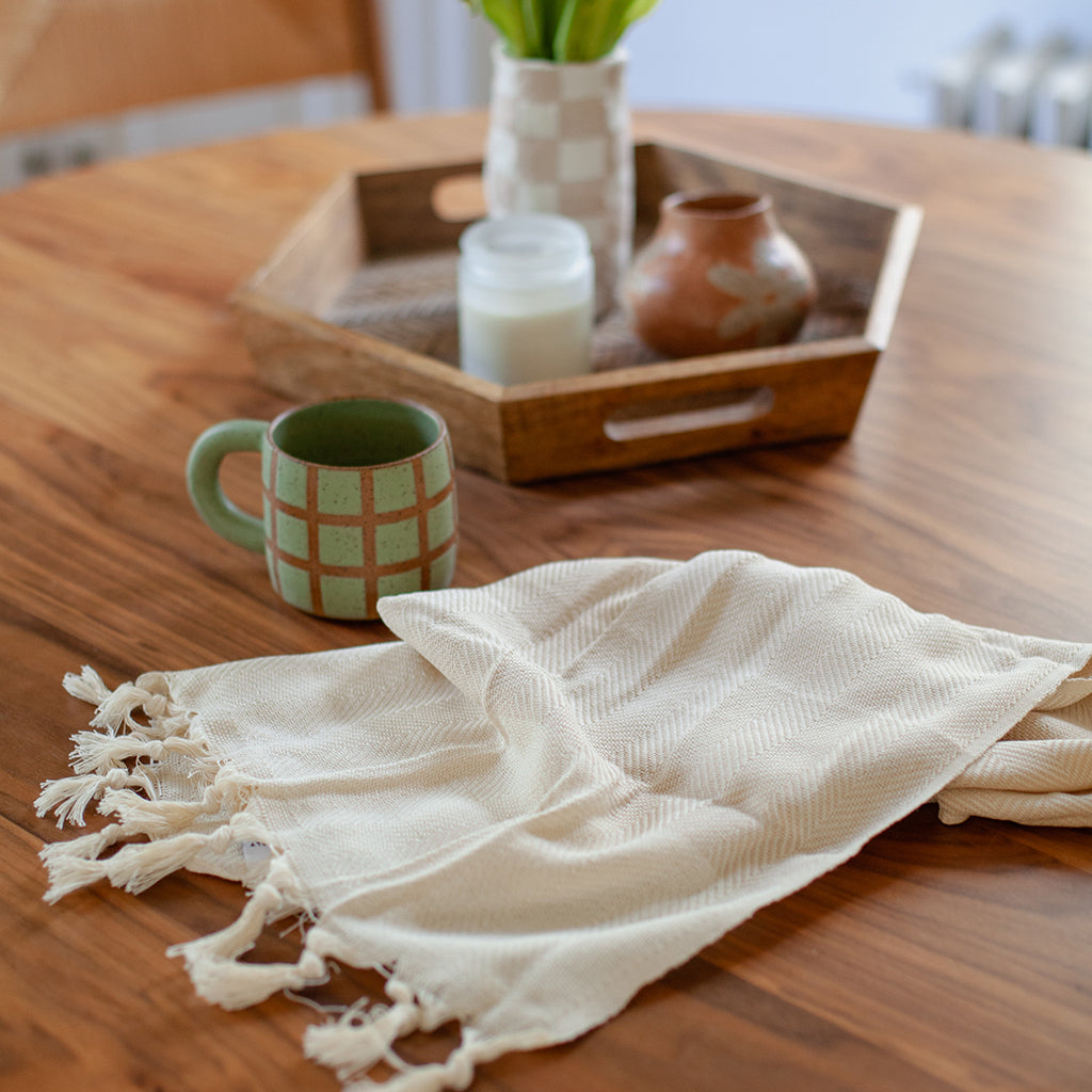 Herringbone Turkish Hand Towel showcasing hand-knotted fringe edges and elegant design, made from 100% Turkish cotton.