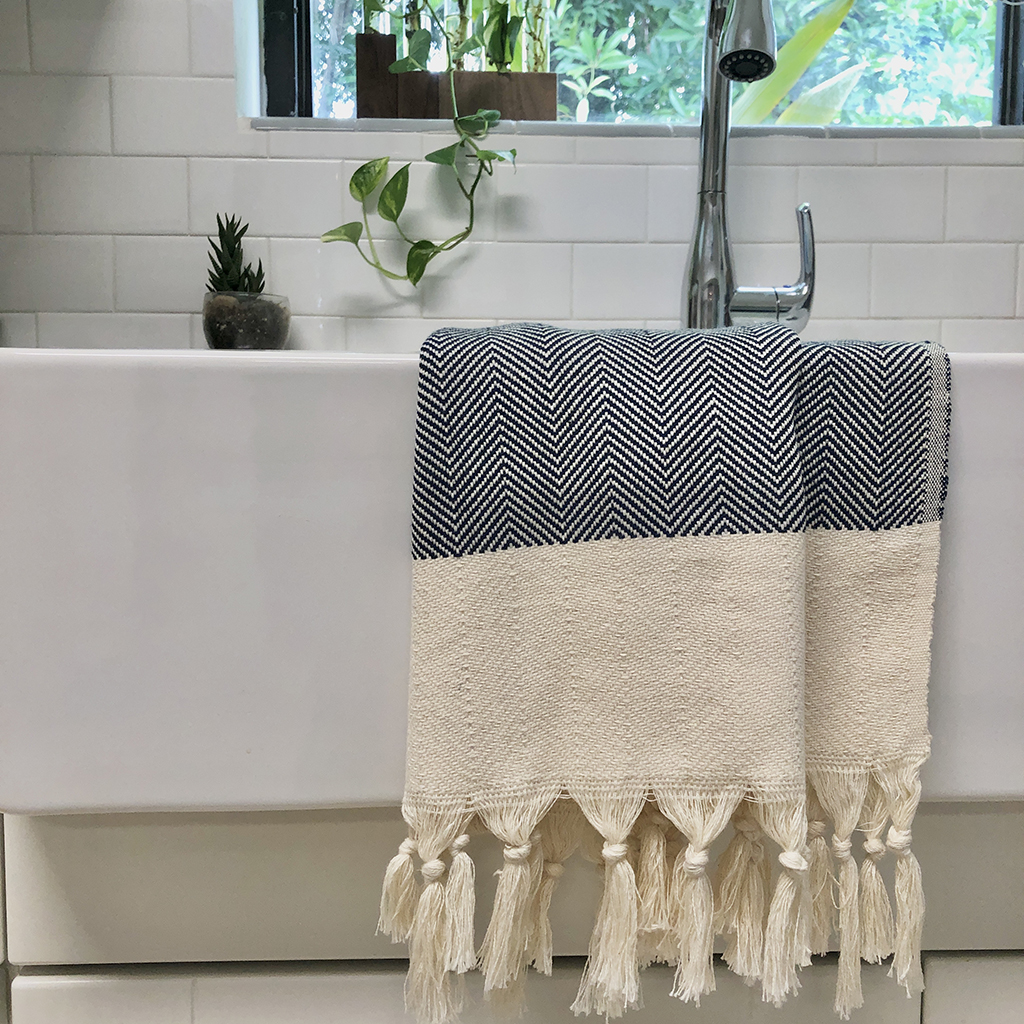 Herringbone Turkish Hand Towel showcasing hand-knotted fringe edges and elegant design, made from 100% Turkish cotton.