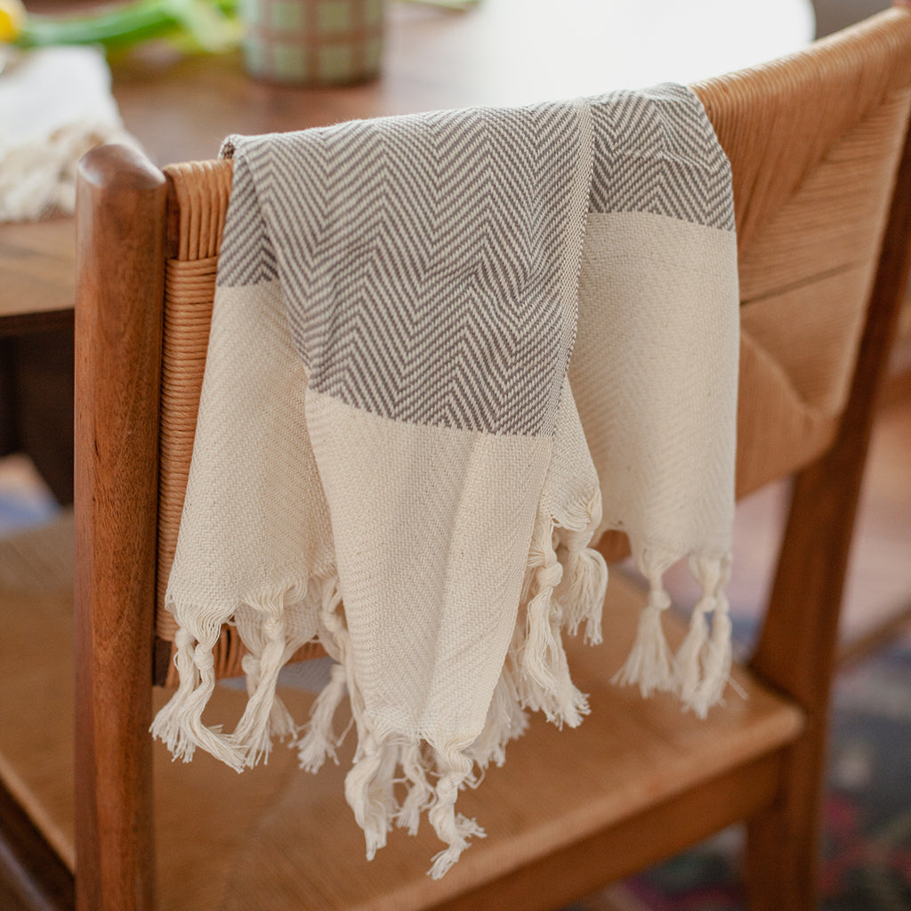 Herringbone Turkish Hand Towel showcasing hand-knotted fringe edges and elegant design, made from 100% Turkish cotton.