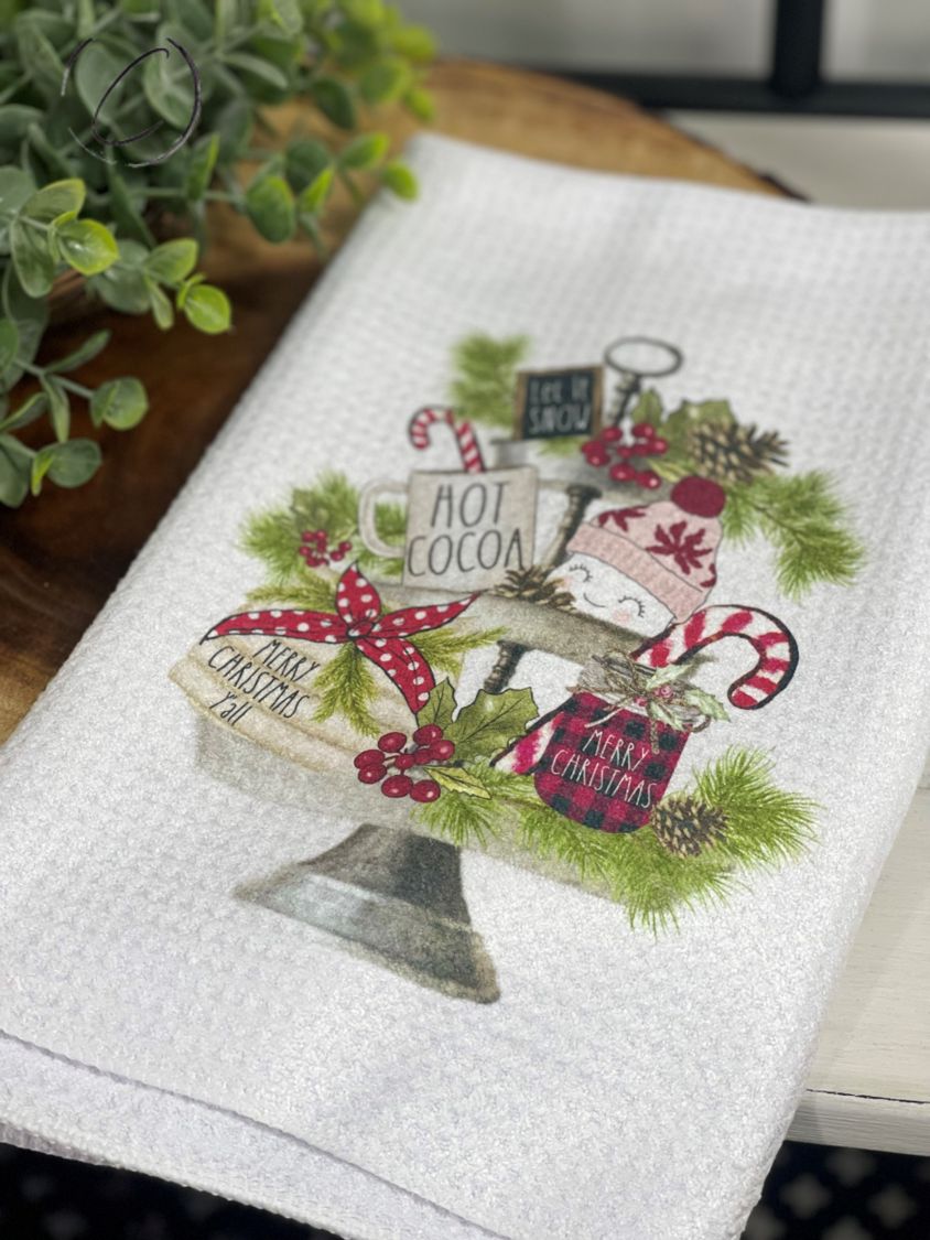 Holiday Tier Tray Waffle Weave Tea Towel in a kitchen setting, showcasing its design and texture.