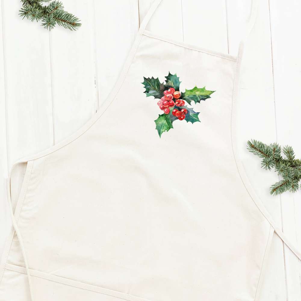 Holly and Berries Women's Apron featuring a stylish design with natural twill ties and a divided front pocket, made from durable cotton canvas.