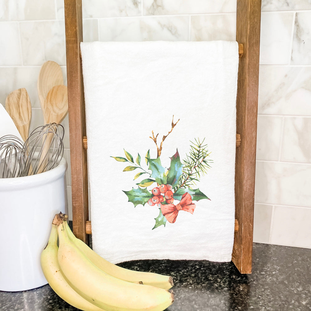 Holly Bundle with Bow cotton tea towel featuring a festive design, perfect for holiday kitchen decor.