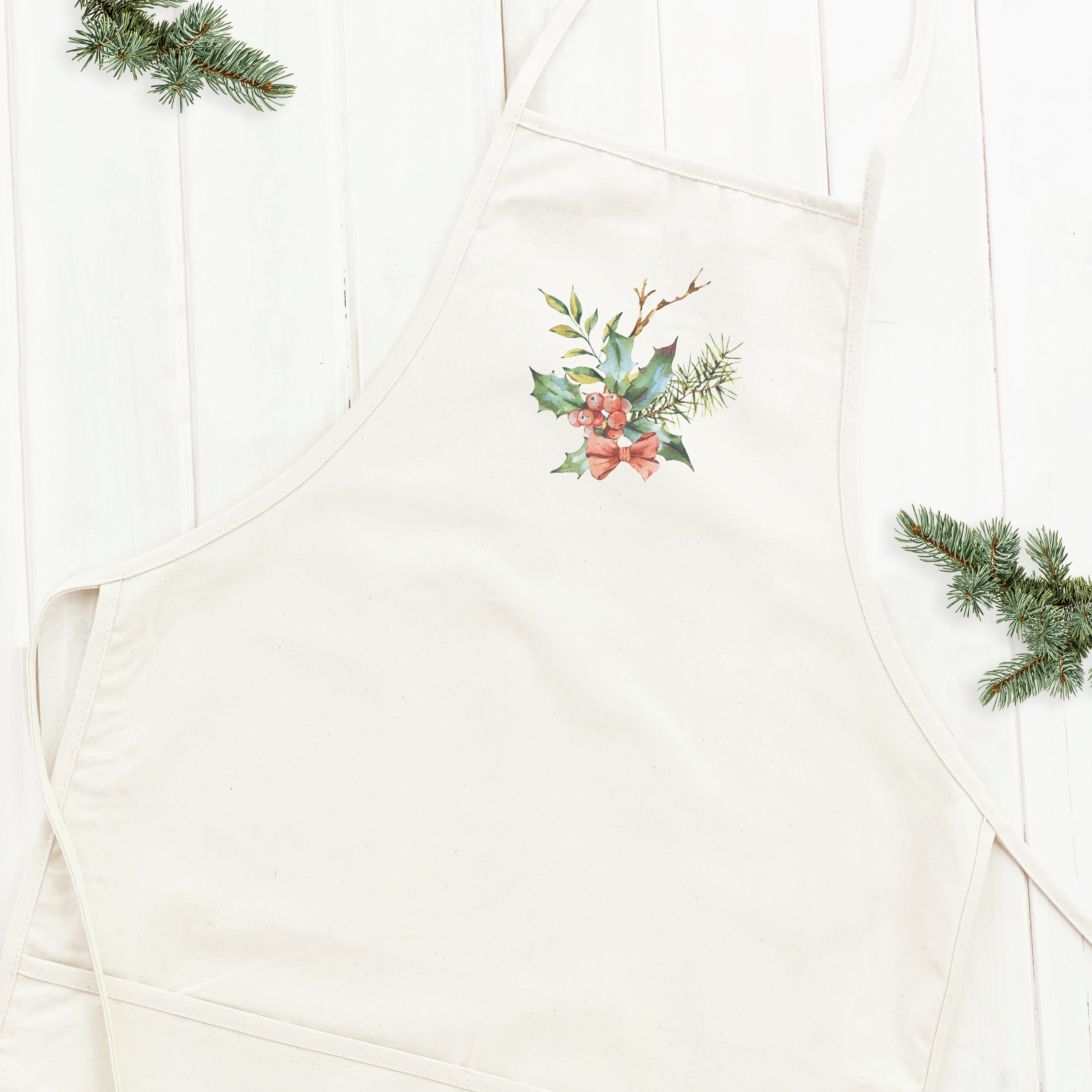 Holly Bundle with Bow Women's Apron featuring elegant design, natural twill ties, and divided front pocket, made from durable cotton canvas.