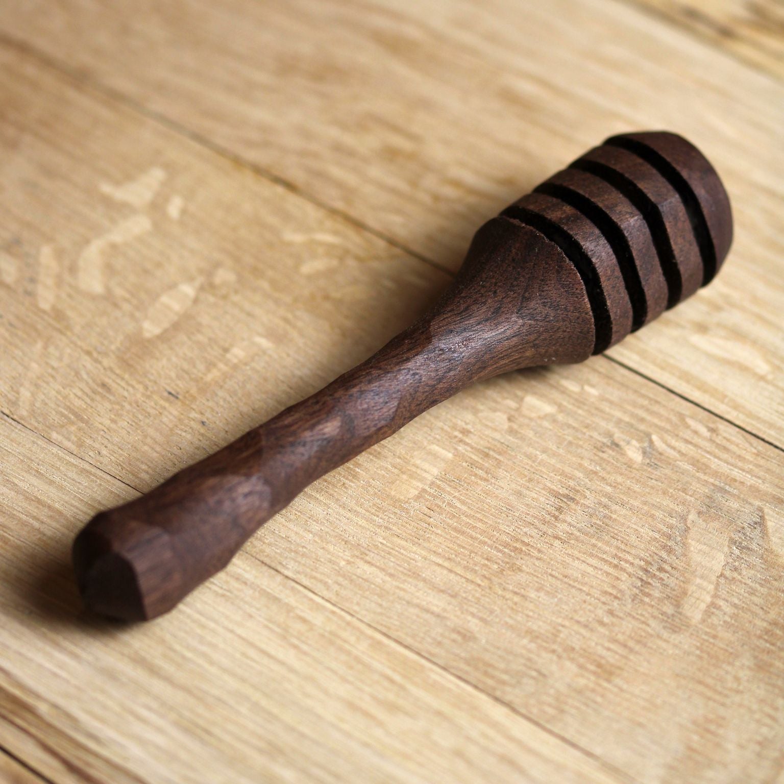 5-inch handcarved honey dipper made from pre-fallen lumber with a chiseled grip handle, finished with olive oil and beeswax.