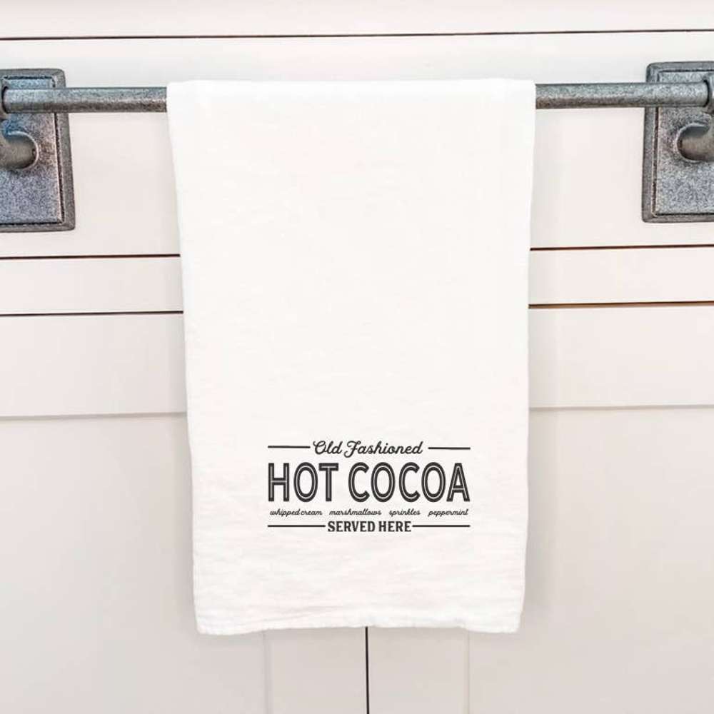 A charming cotton tea towel featuring a hot cocoa design, perfect for kitchen use.