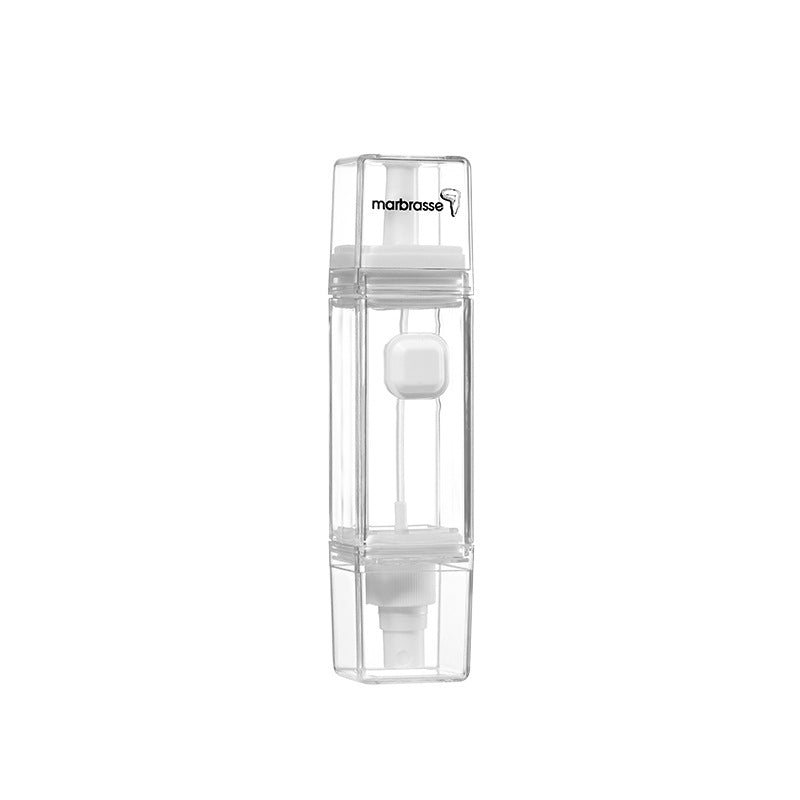 A transparent leak-proof oil bottle made from Tritan, designed for kitchen use, showcasing its compact size and sleek design.