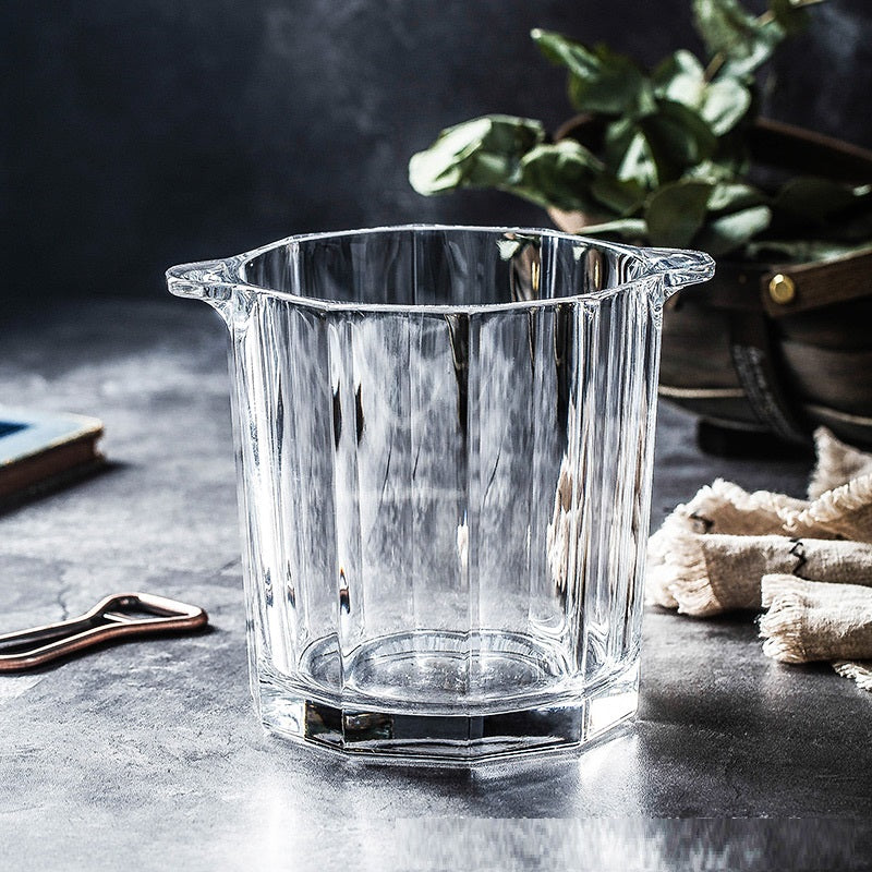 A stylish crystal glass ice bucket designed for chilling whisky, champagne, and red wine, featuring a sleek and elegant design.