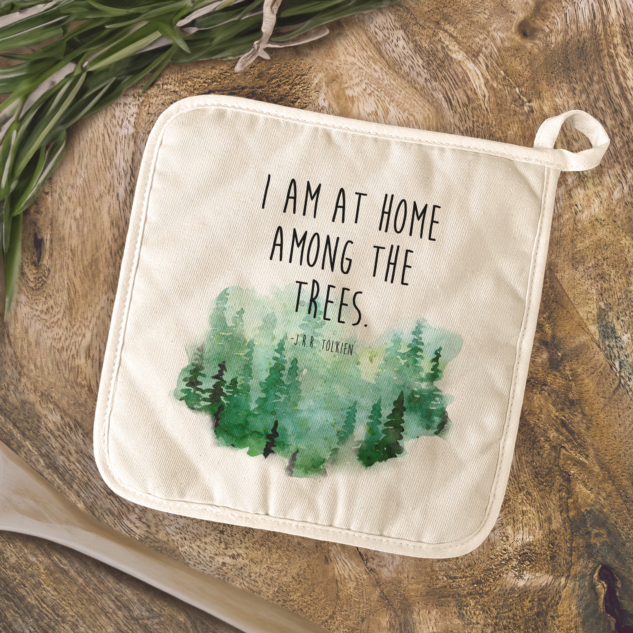 I am at Home Among the Trees cotton pot holder featuring vibrant nature-inspired designs and a convenient square shape.