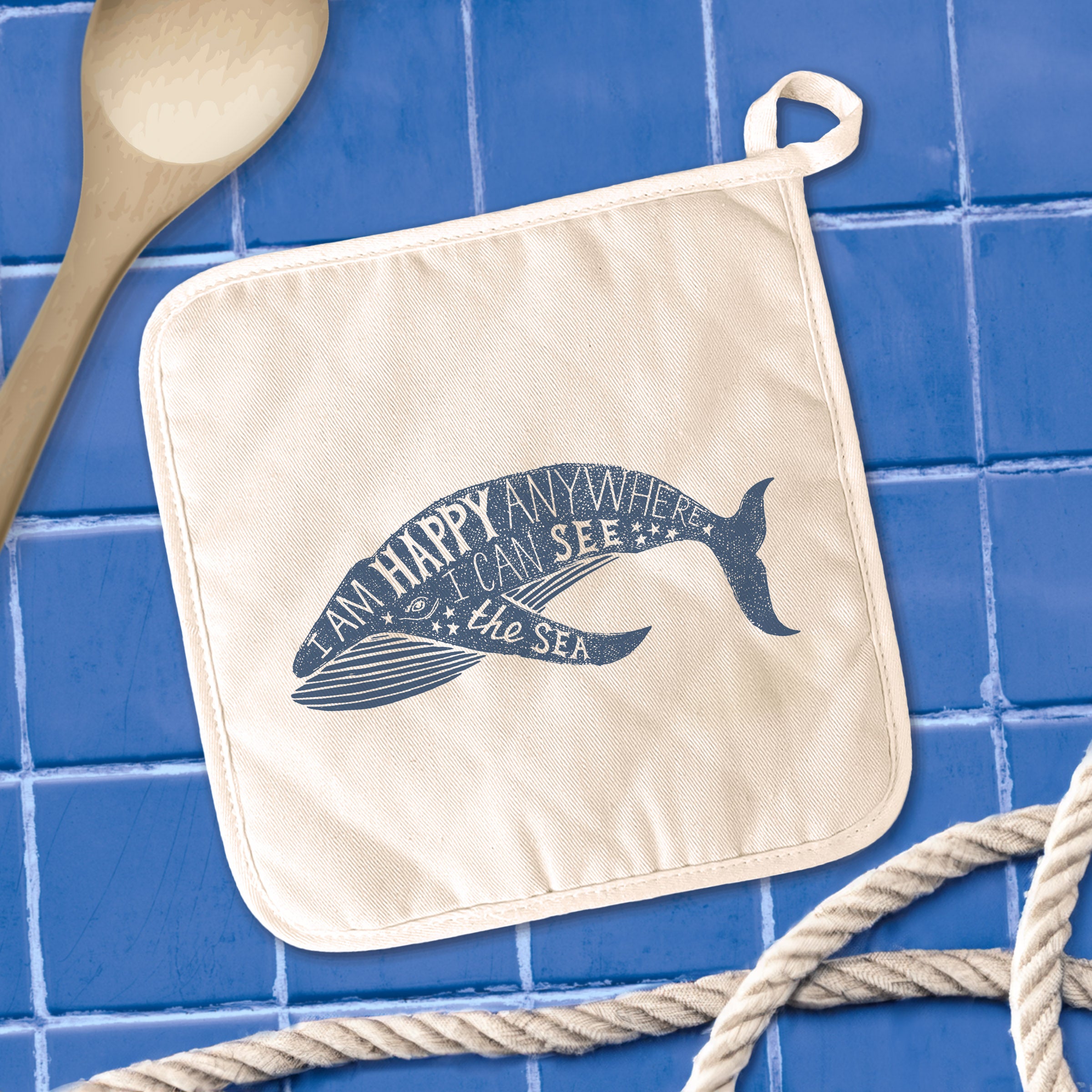 I am Happy Anywhere Whale Cotton Pot Holder featuring a vibrant whale design, made from durable cotton and terry cloth.