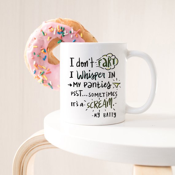 A humorous coffee mug with the phrase 'I Don't Fart. I Whisper' printed on it, showcasing a fun design perfect for gifting.