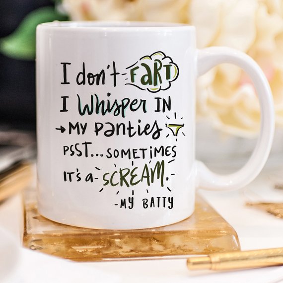 A humorous coffee mug with the phrase 'I Don't Fart. I Whisper' printed on it, showcasing a fun design perfect for gifting.