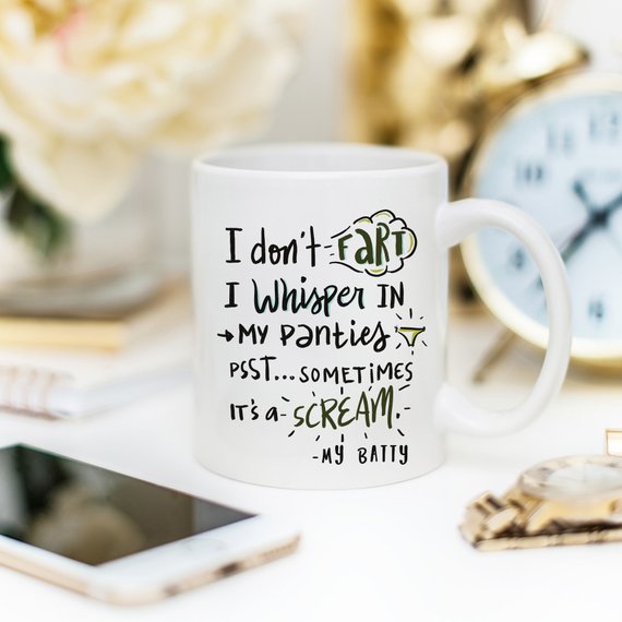 A humorous coffee mug with the phrase 'I Don't Fart. I Whisper' printed on it, showcasing a fun design perfect for gifting.