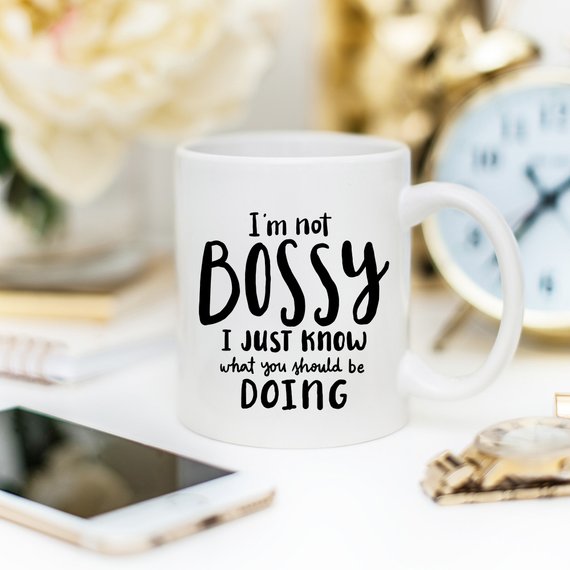 A humorous coffee mug with the phrase 'I'm Not Bossy, I Just Know What You Should Be Doing' printed on it, showcasing a fun design.