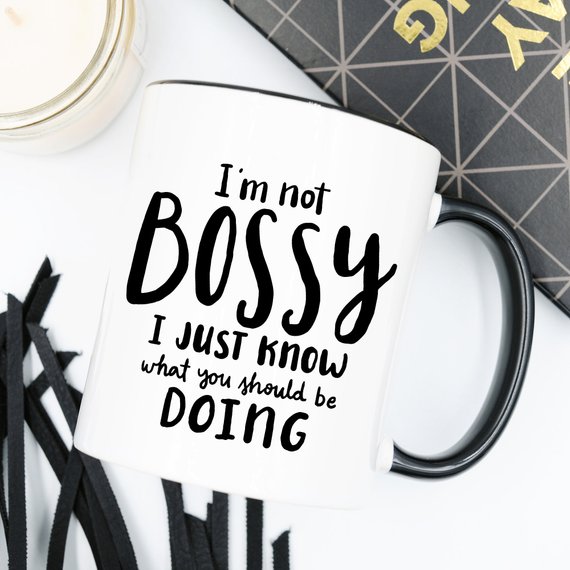 A humorous coffee mug with the phrase 'I'm Not Bossy, I Just Know What You Should Be Doing' printed on it, showcasing a fun design.