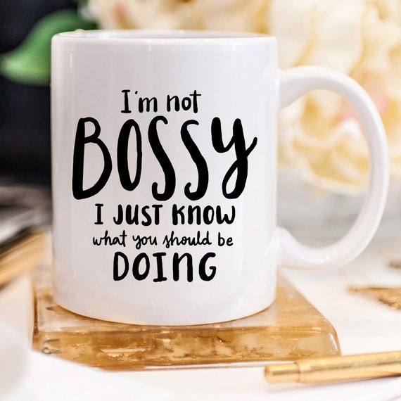 A humorous coffee mug with the phrase 'I'm Not Bossy, I Just Know What You Should Be Doing' printed on it, showcasing a fun design.