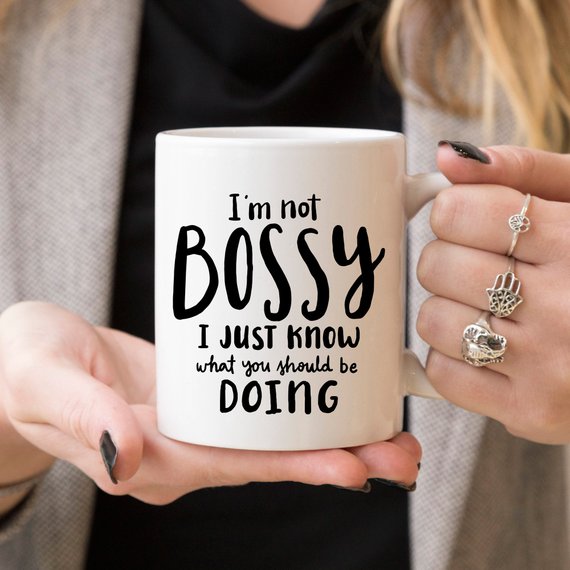 A humorous coffee mug with the phrase 'I'm Not Bossy, I Just Know What You Should Be Doing' printed on it, showcasing a fun design.