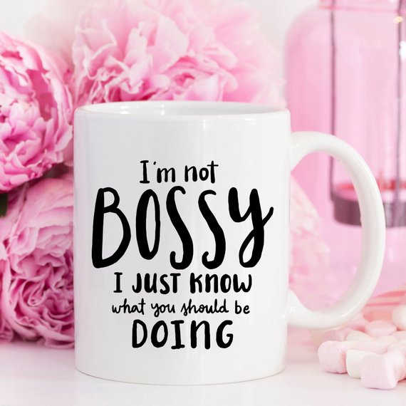 A humorous coffee mug with the phrase 'I'm Not Bossy, I Just Know What You Should Be Doing' printed on it, showcasing a fun design.