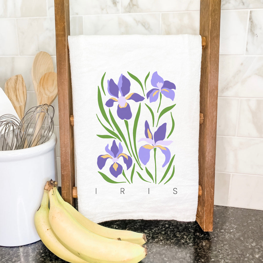 Iris Cotton Tea Towel featuring a vibrant garden design, made from 100% absorbent cotton, perfect for kitchen use.