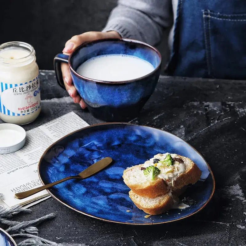 Isa Breakfast Set featuring handcrafted ceramic pieces in a beautiful blue hue, showcasing natural shapes for an elegant dining experience.