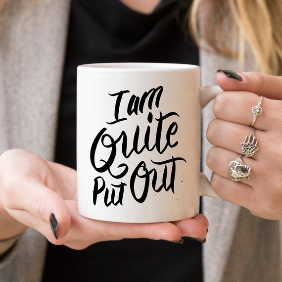 Jane Austen coffee mug featuring the phrase 'I Am Quite Put Out', crafted from high-grade ceramic, perfect for coffee lovers.