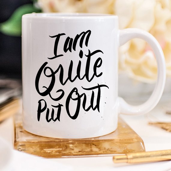 Jane Austen coffee mug featuring the phrase 'I Am Quite Put Out', crafted from high-grade ceramic, perfect for coffee lovers.