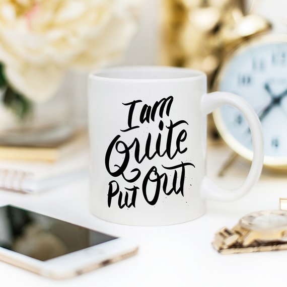 Jane Austen coffee mug featuring the phrase 'I Am Quite Put Out', crafted from high-grade ceramic, perfect for coffee lovers.