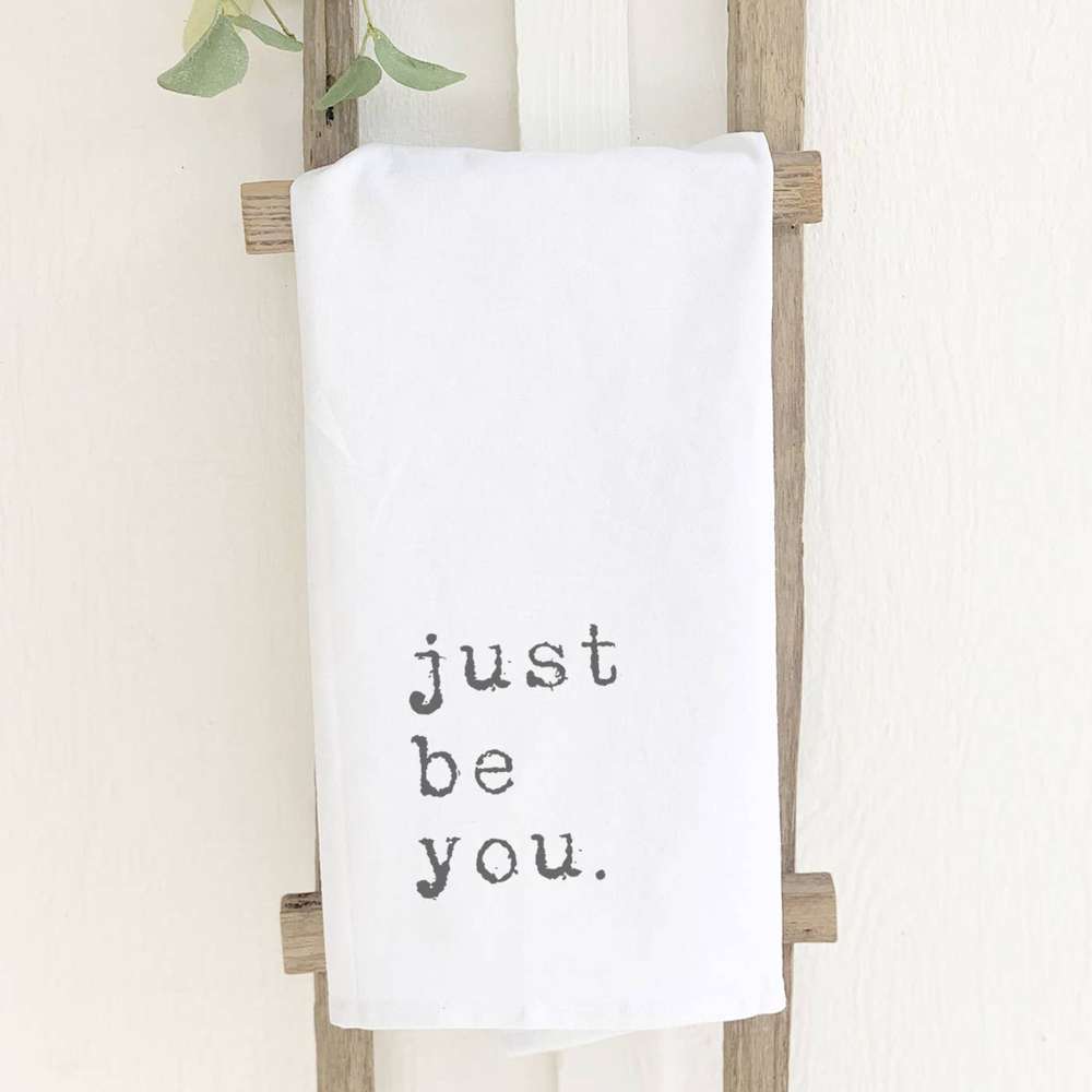 Just Be You Cotton Tea Towel featuring vibrant designs and hemmed edges, perfect for kitchen use.