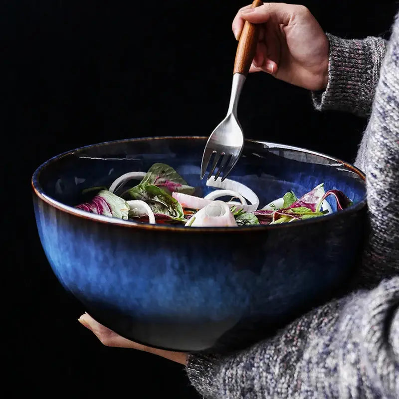 A handcrafted ceramic Kaia bowl in a subtle blue shade, ideal for serving sushi, ramen, and miso soup, showcasing its elegant and minimalist design.