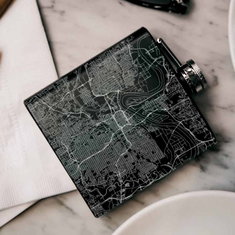 Custom engraved matte black hip flask featuring a Kansas City map and coordinates, with a canvas bag and funnel included.