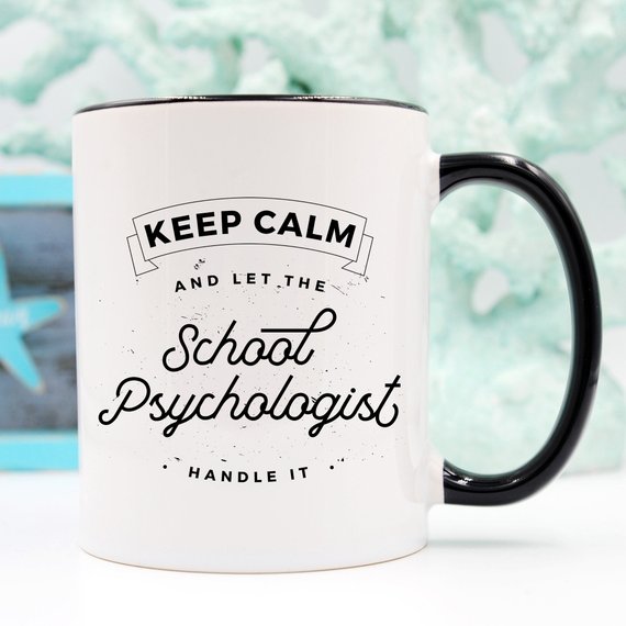 A humorous coffee mug featuring the phrase 'Keep Calm And Let The School Psychologist Handle It', made of high-quality ceramic.