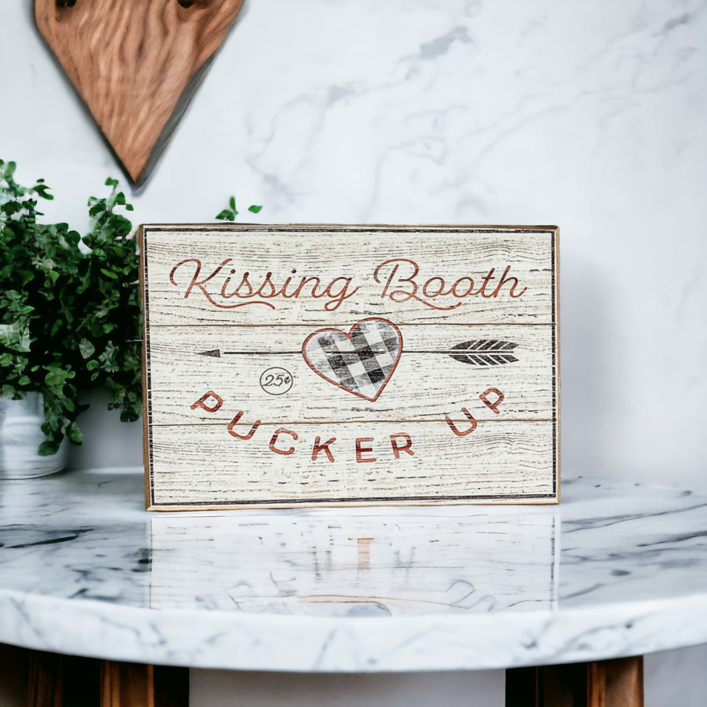 Handmade wooden Kissing Booth sign, perfect for Valentine's Day decor, showcasing a rustic design with a timeless appeal.