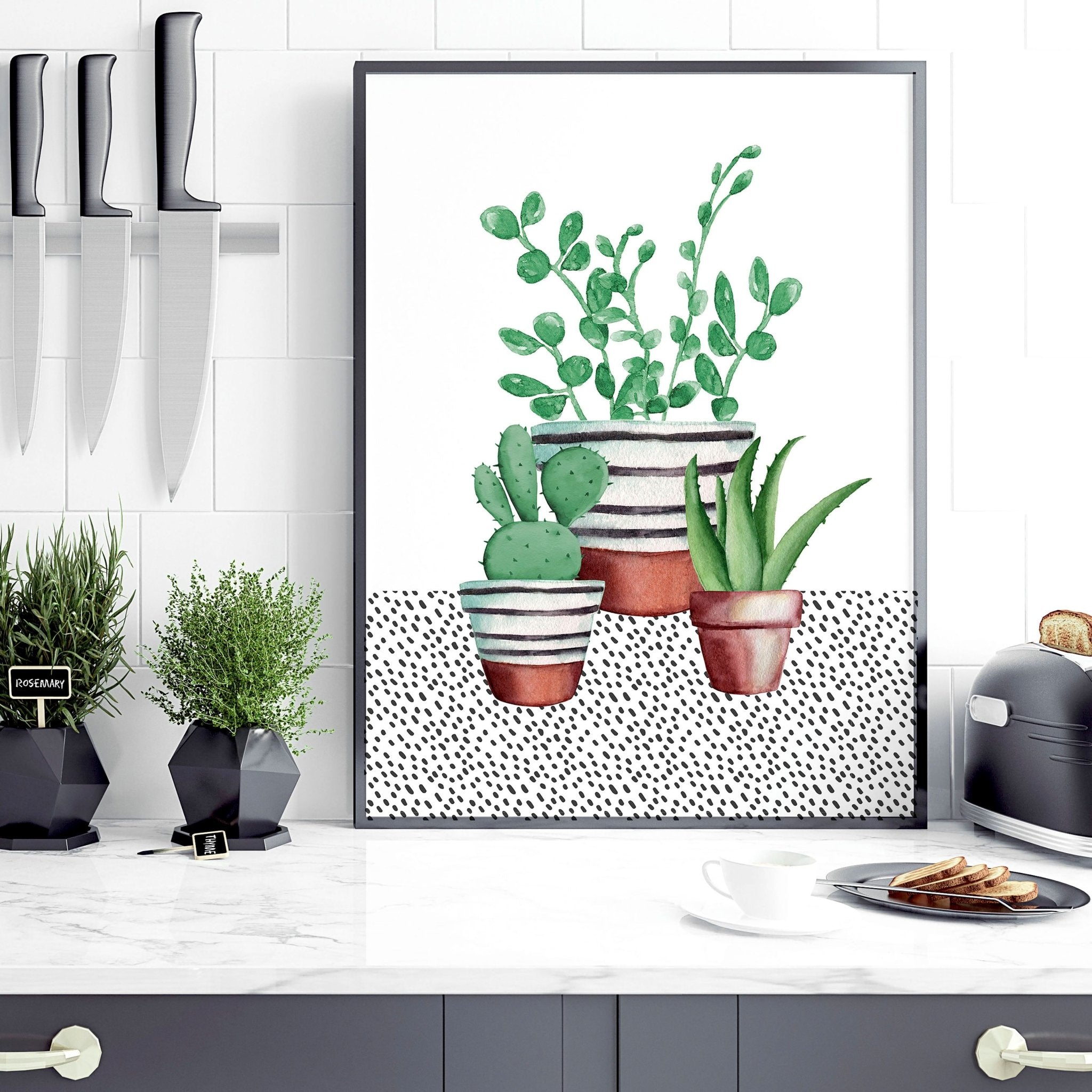 Set of 2 wall art prints featuring vibrant watercolour illustrations of succulent plants, perfect for kitchen decor.