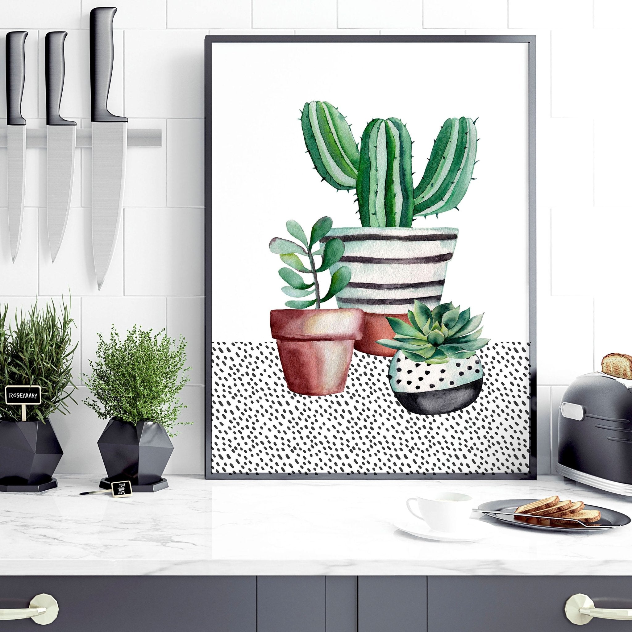 Set of 2 wall art prints featuring vibrant watercolour illustrations of succulent plants, perfect for kitchen decor.