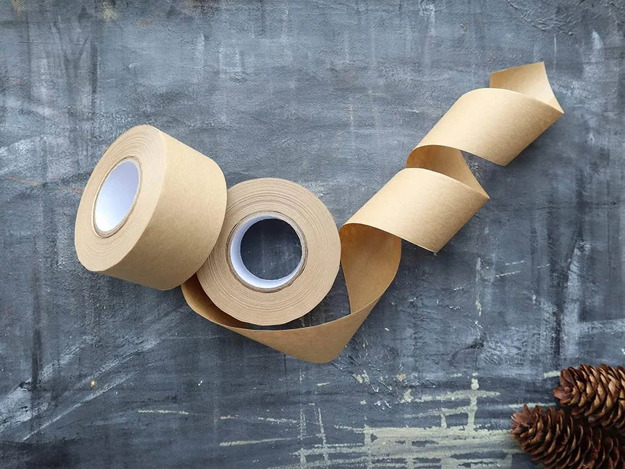 Eco-friendly Kraft Paper Tape on a roll, showcasing its natural texture and water-activated adhesive properties.