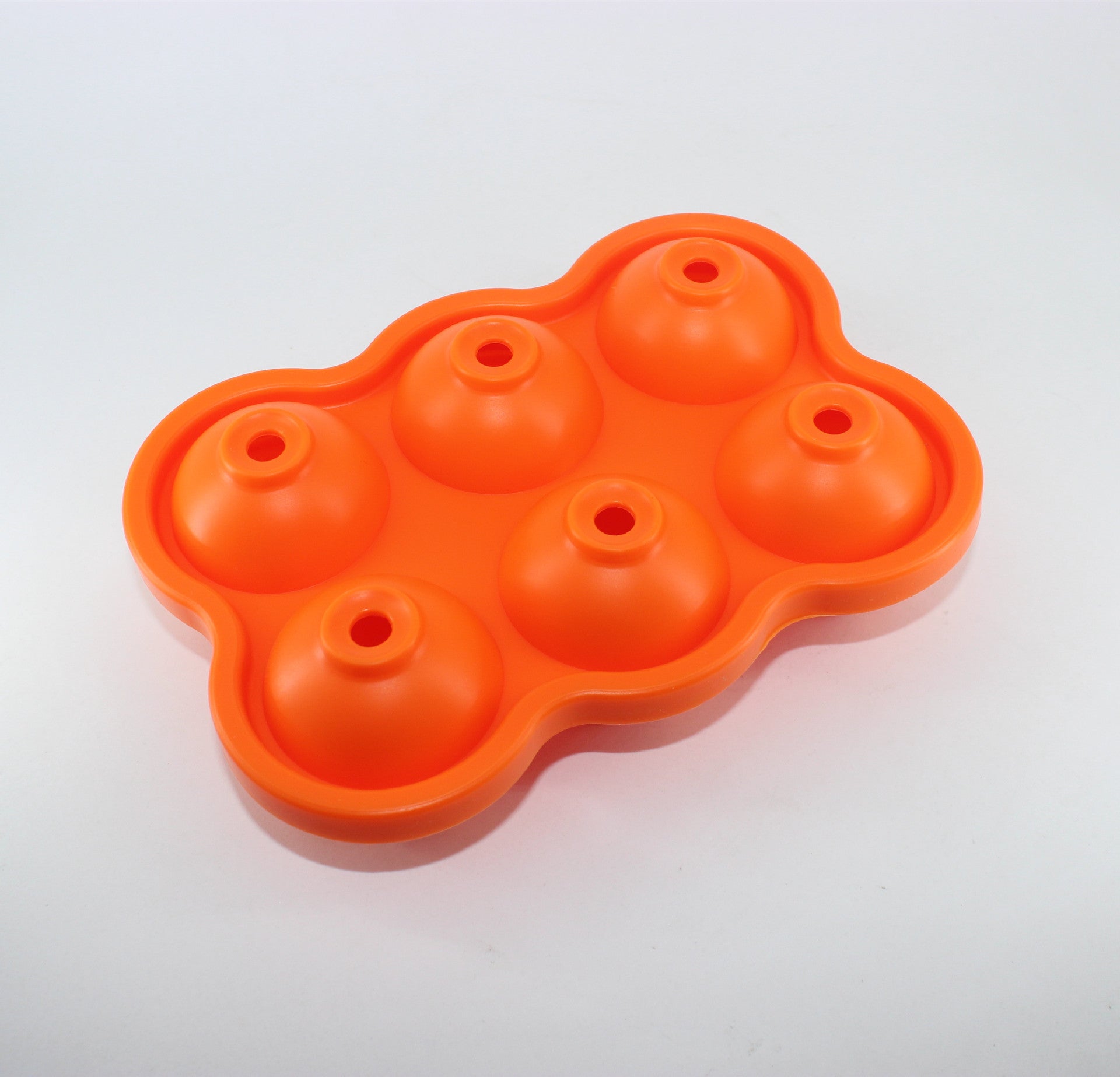 Large Ice Cube Maker Silicone Mold with six cells for making ice balls, showcasing its flexible design and food-grade silicone material.