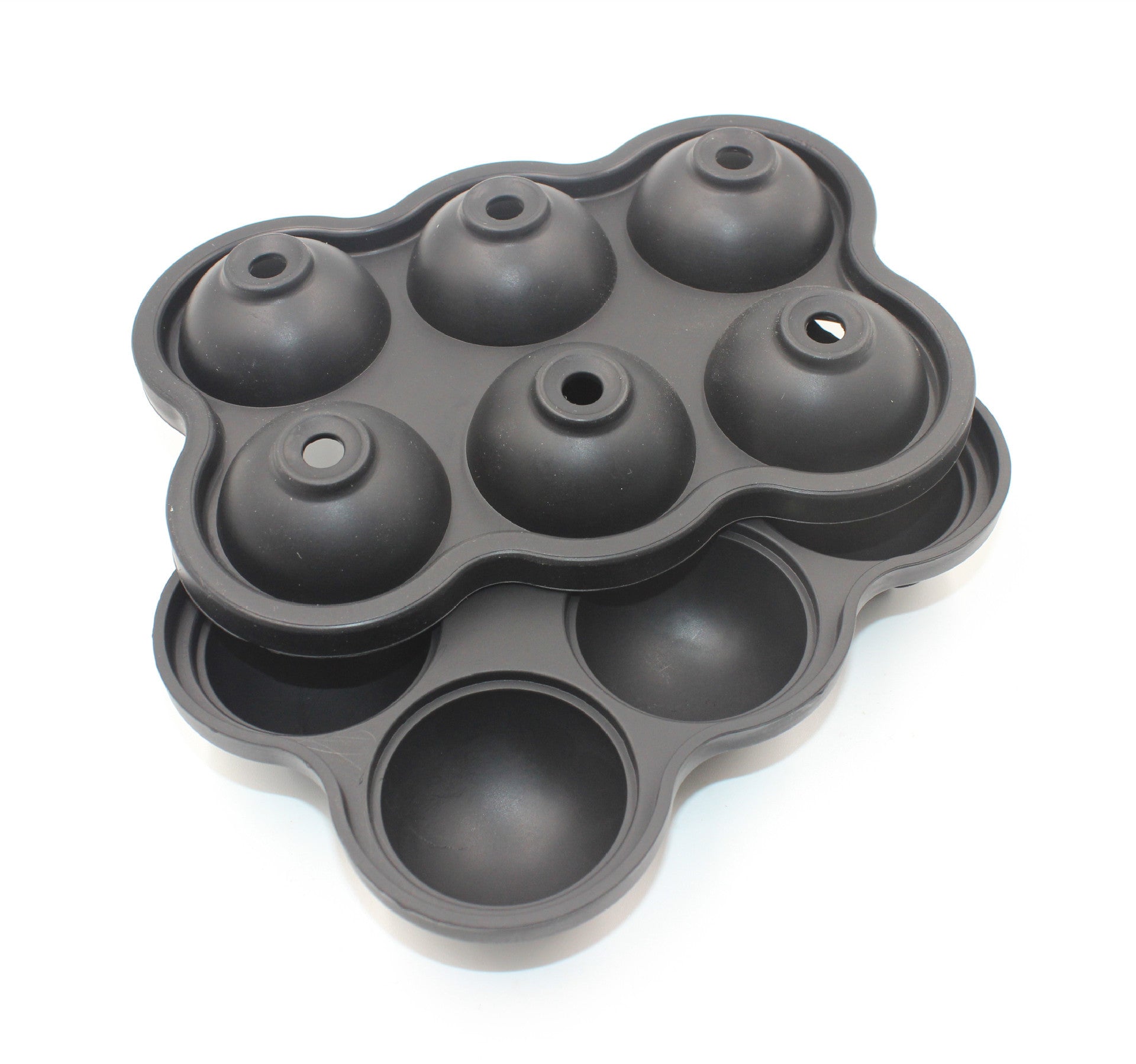 Large Ice Cube Maker Silicone Mold with six cells for making ice balls, showcasing its flexible design and food-grade silicone material.