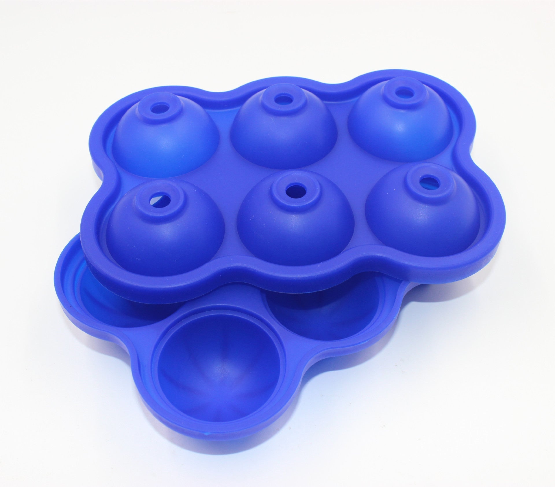 Large Ice Cube Maker Silicone Mold with six cells for making ice balls, showcasing its flexible design and food-grade silicone material.