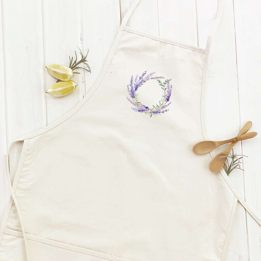 Lavender Wreath Women's Apron featuring elegant design, adjustable neck, and divided front pocket, made from durable cotton canvas.