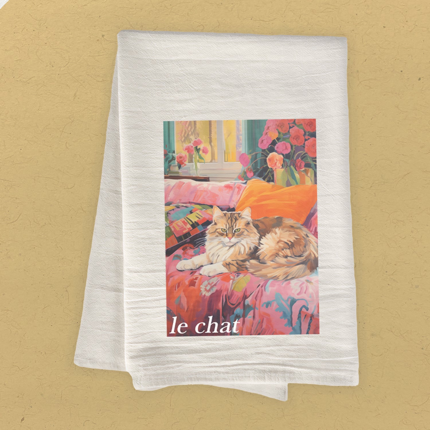 Le Chat Cotton Tea Towel featuring a charming cat design, made from 100% absorbent cotton, vibrant colors, and hemmed edges.