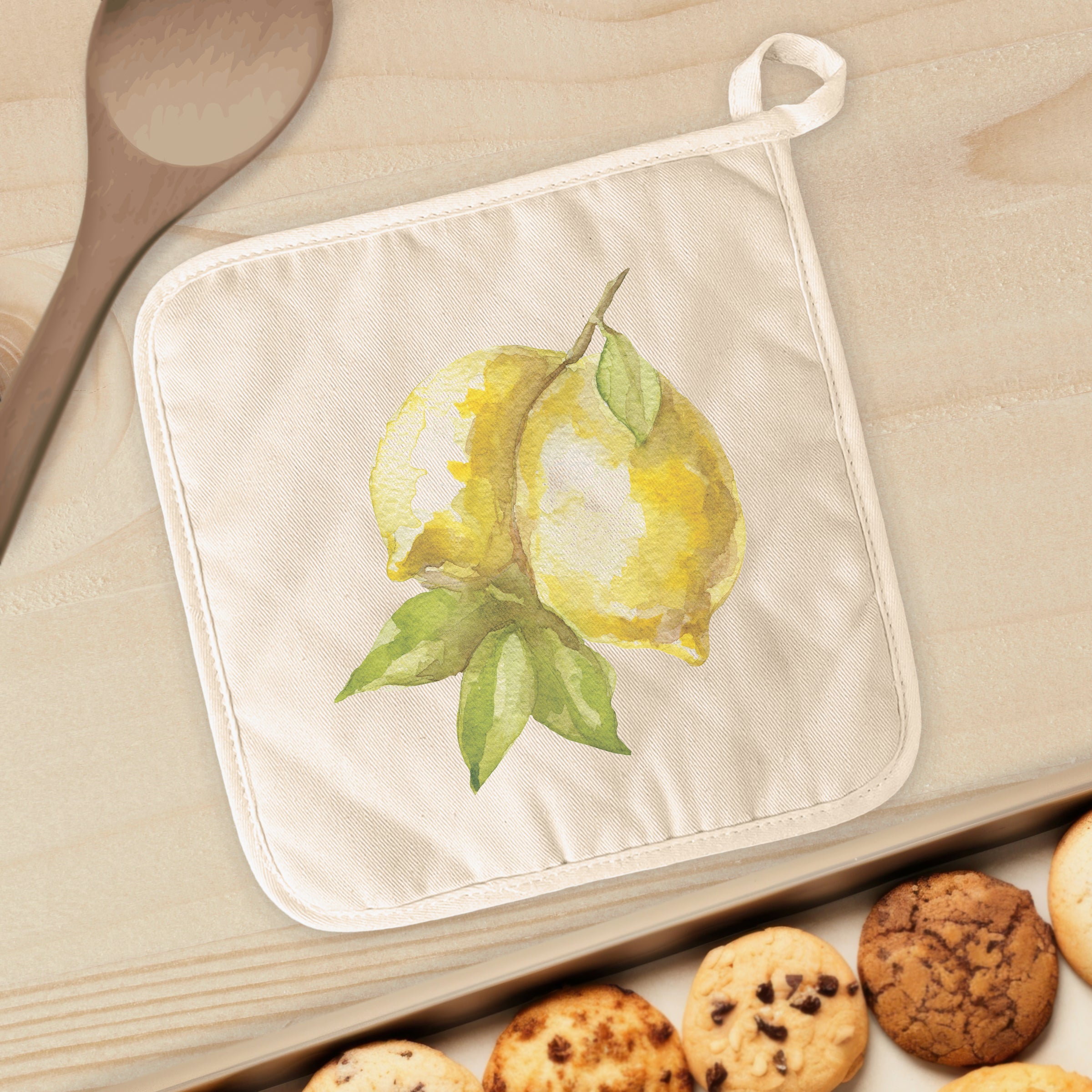 Lemons Cotton Pot Holder featuring vibrant lemon design, quilted terry cloth, and convenient hanging loop.