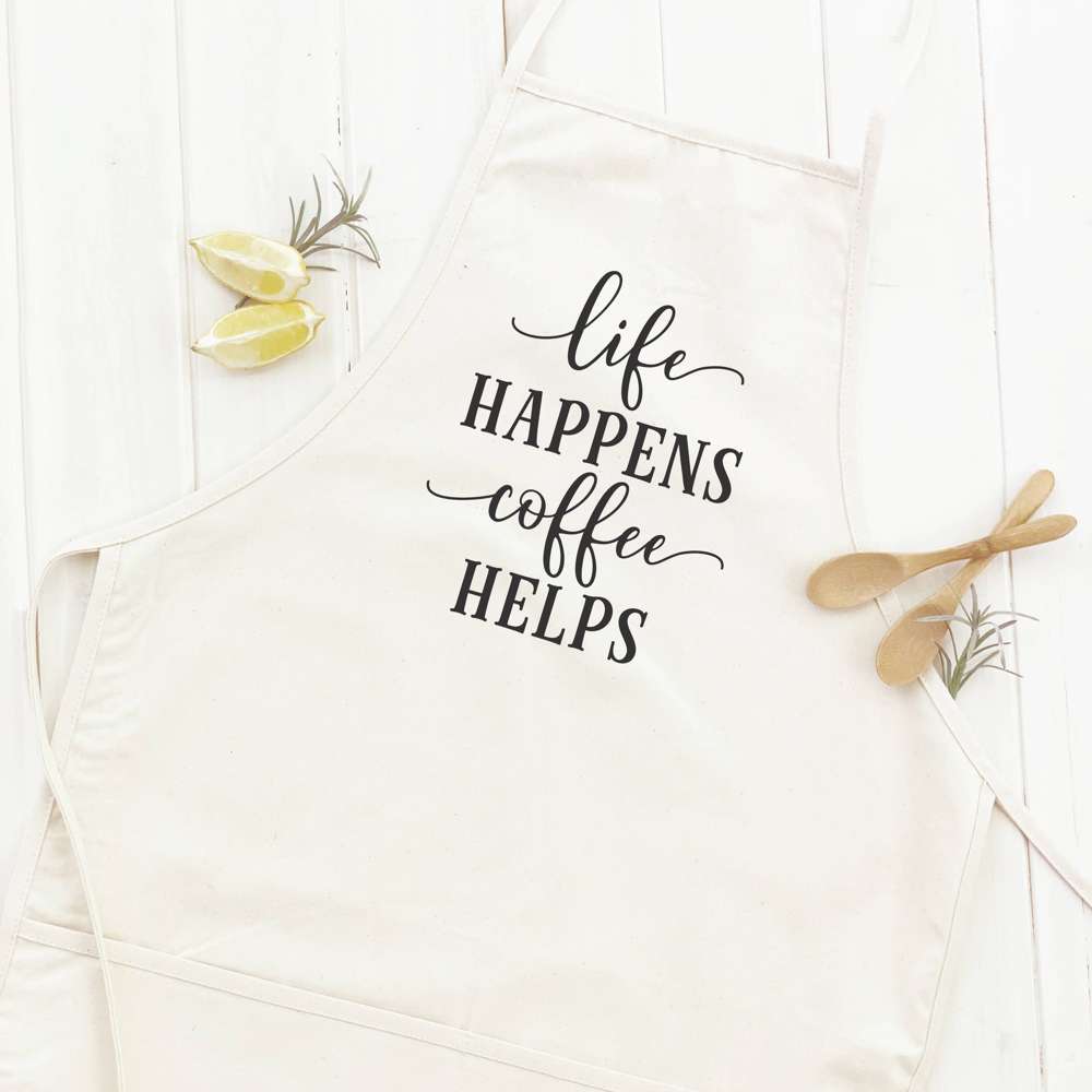 Life Happens Coffee Helps apron featuring a simple design, adjustable neck, and divided front pocket, made from durable cotton canvas.