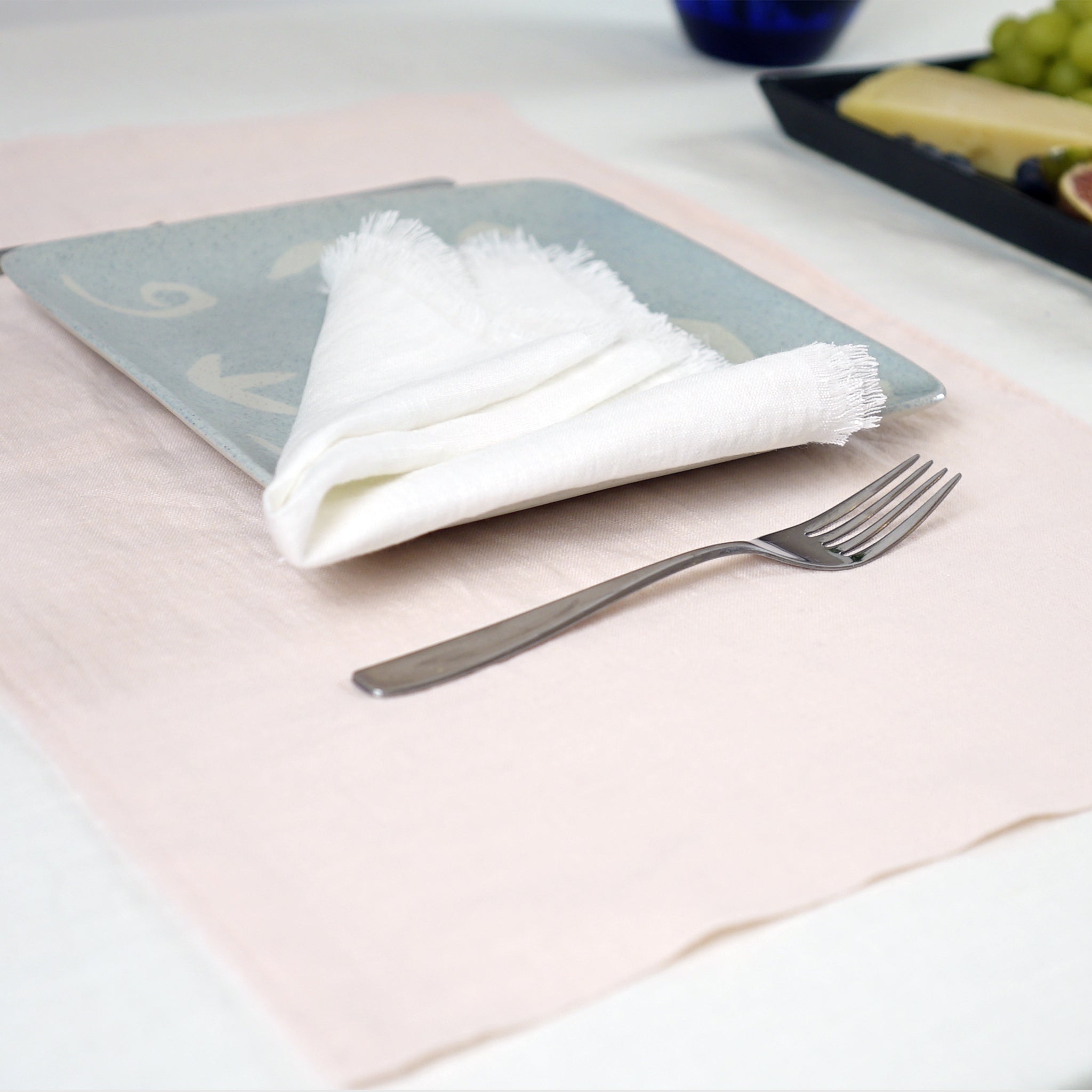 Light pink linen placemats set, handcrafted from natural stonewashed linen, elegantly styled for modern dining.