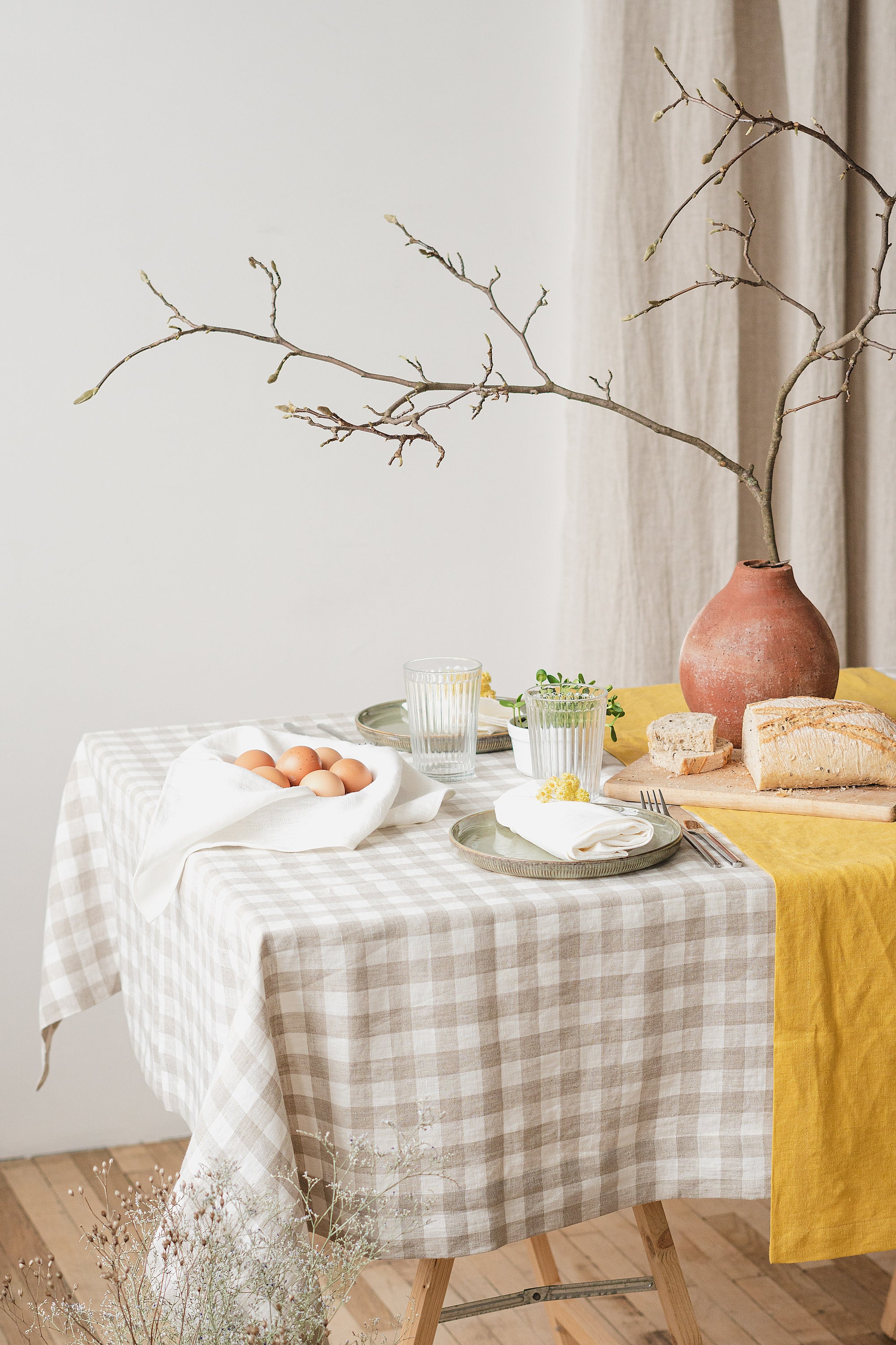 Elegant linen tablecloths in various colors and sizes, showcasing high-quality European linen with a decorative hem.