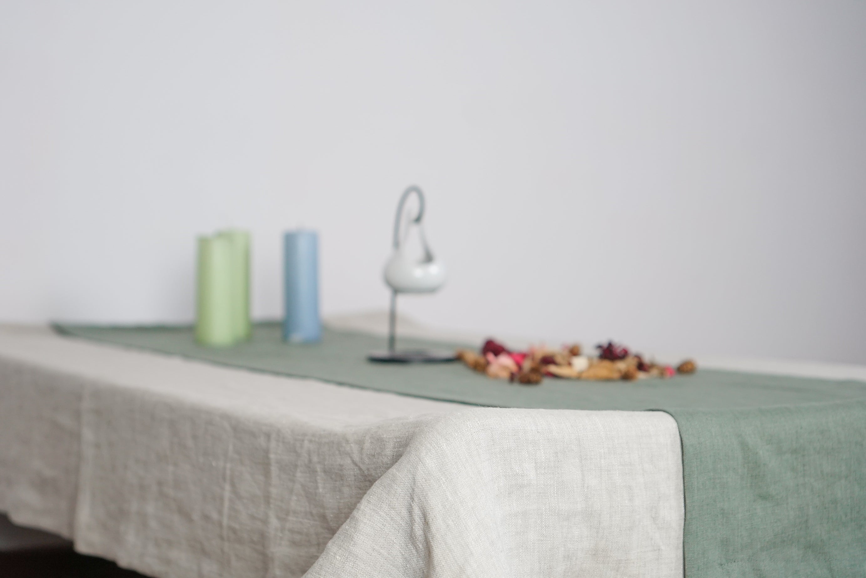 Elegant linen tablecloths in various colors and sizes, showcasing high-quality European linen with a decorative hem.